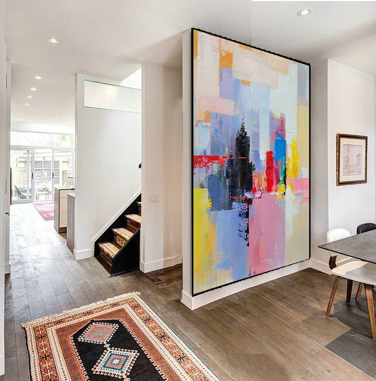 Modern hallway with large abstract canvas painting, wooden floor, and colorful rug