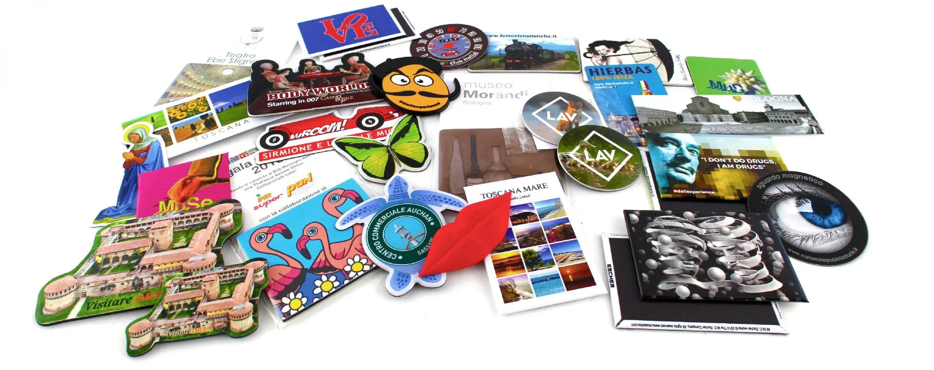 Assorted custom printed magnets with colorful designs, shapes, and imagery for advertising.